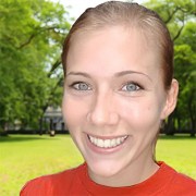 Smiling young blonde woman with hair pulled back